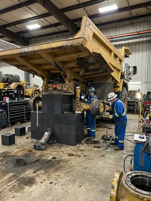 Plastic cribbing blocks supporting heavy-duty industrial equipment